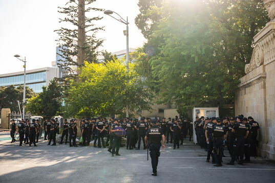 Police gather outside of Tofiq Bahramov