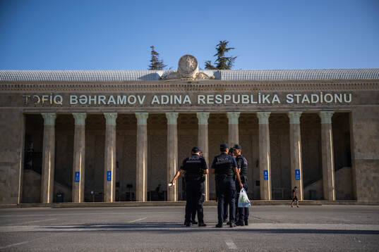 Police gather outside of Tofiq Bahramov