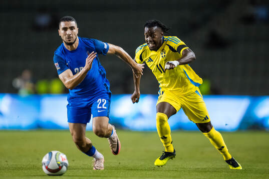 Aleksey Isaev of Azerbaijan and Anthony Elanga of Sweden