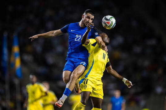 Aleksey Isaev of Azerbaijan and Anthony Elanga of Sweden