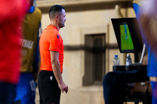 Referee Balazs Berke with a VAR review