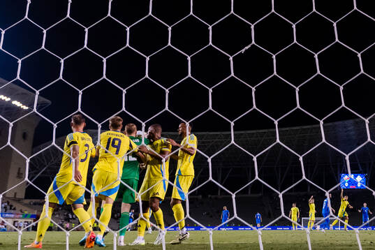Players of Sweden celebrate with goalkeeper Viktor
