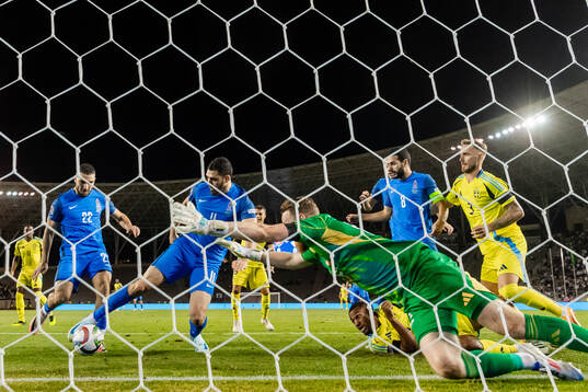 Emin Makhmudov of Azerbaijan and goalkeeper Viktor