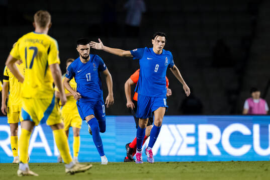 Ramil Sheydaev and Joshgun Diniyev of Azerbaijan celebrate