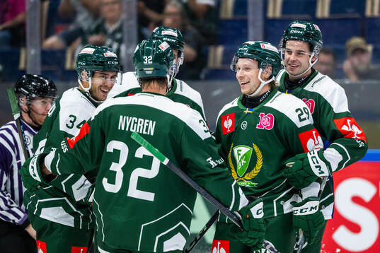 Oscar Steen of Färjestad celebrates with team mates