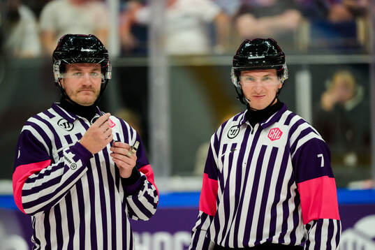 Referees DanielEriksson and Christoffer Holm
