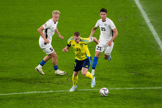 Dejan Kulusevski of Sweden competes for the ball with Rocco
