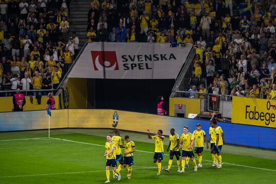 Alexander Isak of Sweden celebrates with team mates