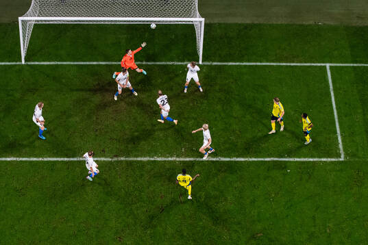 Alexander Isak of Sweden scores 2-0 behind goalkeeper Karl