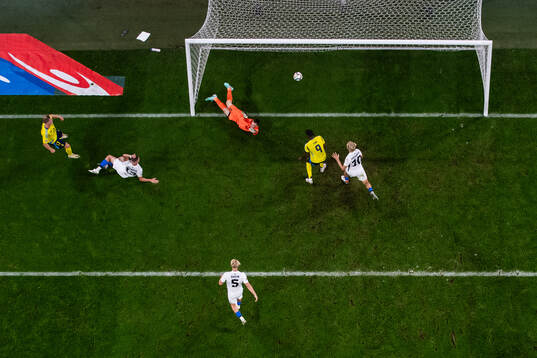 Viktor Gyökeres of Sweden scores 1-0 behind goalkeeper