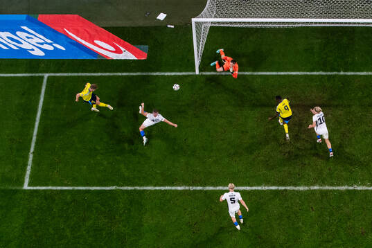 Viktor Gyökeres of Sweden scores 1-0 behind goalkeeper