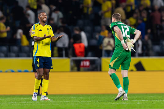 Isak Hien and goalkeeper Viktor Johansson of Sweden