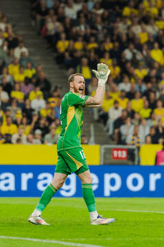Goalkeeper Viktor Johansson of Sweden celebrates