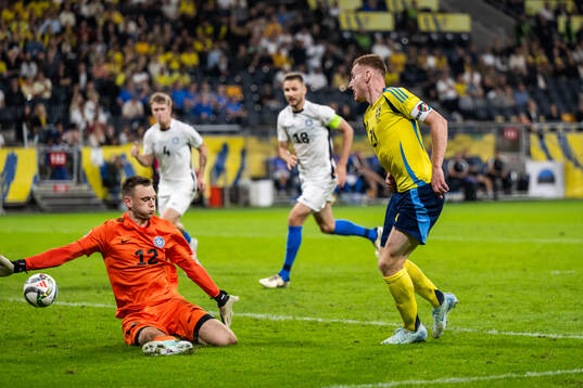 Dejan Kulusevski of Sweden with a pass past goalkeeper Karl