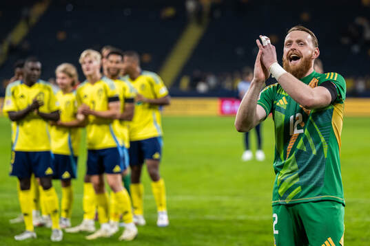 Goalkeeper Viktor Johansson of Sweden celebrates