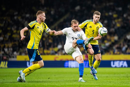 Dejan Kulusevski and Gabriel Gudmundsson of Sweden compete