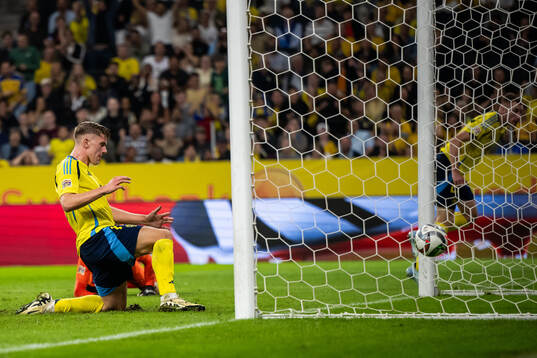 Viktor Gyökeres of Sweden scores 3-0 behind goalkeeper