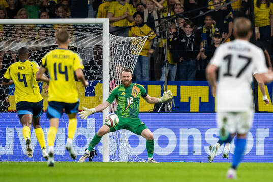Goalkeeper Viktor Johansson of Sweden with a save