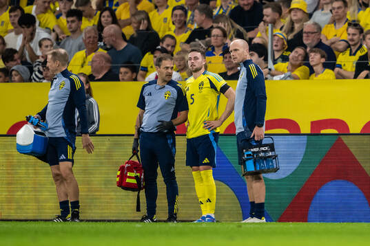 Gabriel Gudmundsson of Sweden receives medcial attention