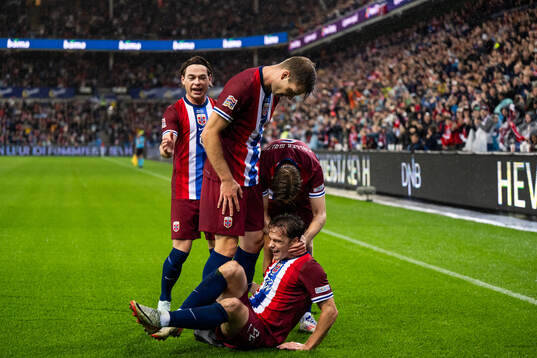 Felix Horn Myhre of Norway celebrates with team mates