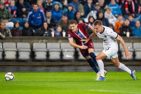 Martin Ødegaard of Norway and Philipp Lienhart of Austria