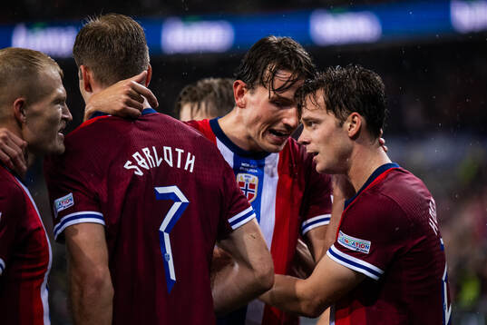 Felix Horn Myhre of Norway celebrates with team mates