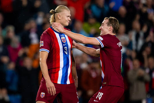 Erling Braut Haaland of Norway celebrates with teammate