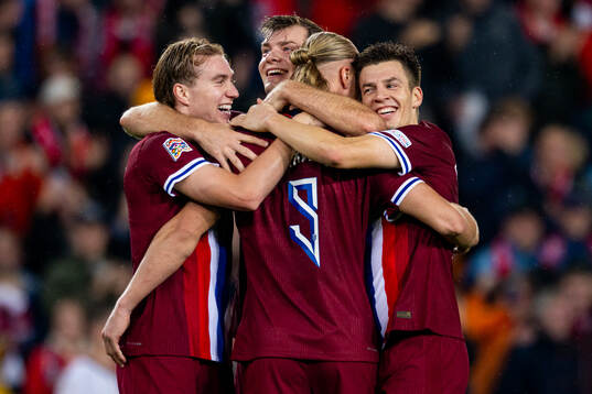 Erling Braut Haaland of Norway celebrates with teammates