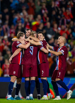 Erling Braut Haaland of Norway celebrates with teammates