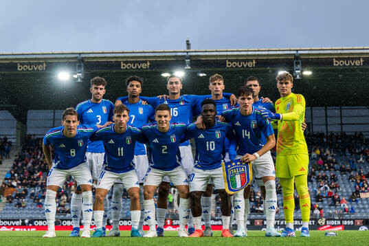 The starting eleven of Italy pose for a team group photo