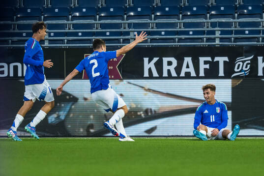 Mattia Zanotti and Wilfried Gnonto of Italy celebrate the