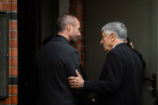 Johan Eriksson, son, greets David Dein, former owner of