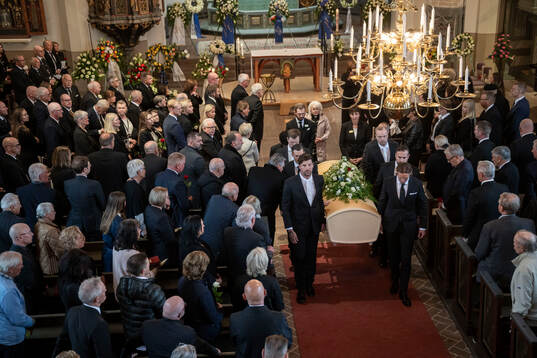 The coffin is carried out