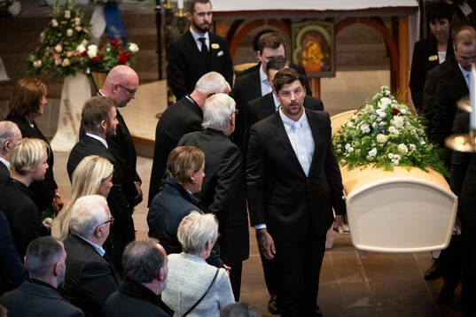 David Beckham watch the coffin being carried out
