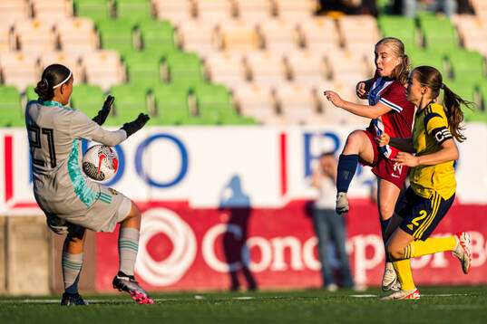 Mie Ingeborg Hoem of Norway missing a chance to score