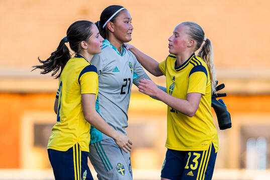 Wilma Svensson and Stina Myrén of Sweden looks dejected