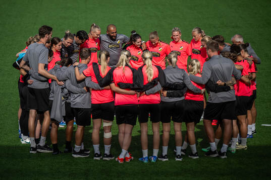 Players and staff gather