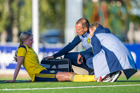 Thea Carlsson of Sweden with an injury