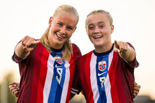 Marie Moen Preus and Tomine Enger of Norway celebrates