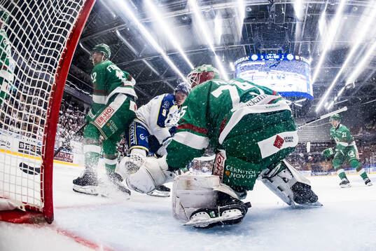 Rögles Brady Ferguson och Leksands Patrik Zackrisson och