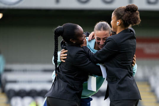 Rosa Kafaji of Arsenal with Monica Jusu Bah and Felicia