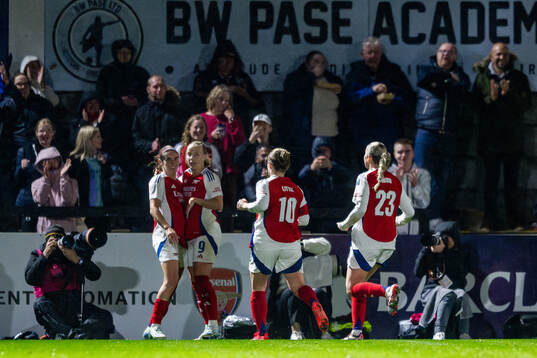 Players of Arsenal celebrate the 2-0 goal by Mariona