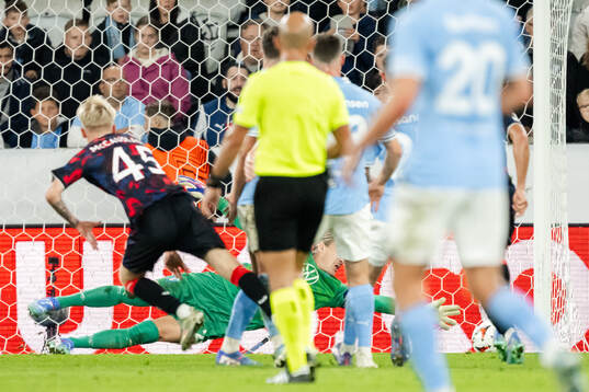 Ross McCausland of Rangers scores the 0-2 goal behind