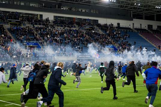 Spectators in the stands celebrates promotion to the