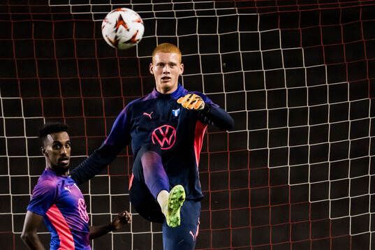 Taha Ali and Goalkeeper Joakim Persson of Malmö FF