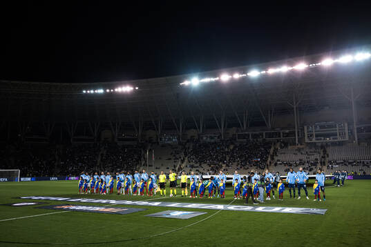 The players at line up ahea dof the UEFA Europa League