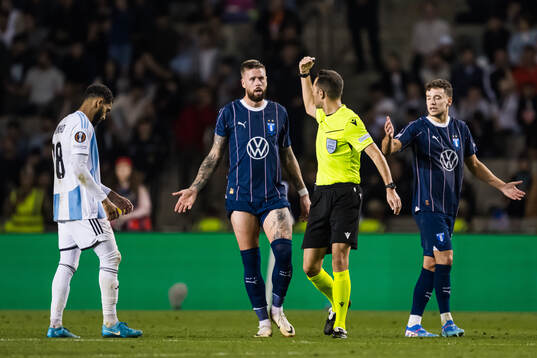 Referee Anastasios Papapetrou and referee Anastasios
