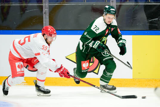 Marian Adamek of Ocelari Trinec and Stian Solberg of