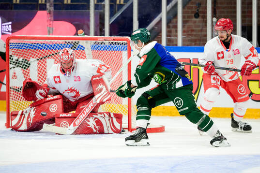 goaltender Marek Mazanec of Ocelari Trinec and Oscar Steen
