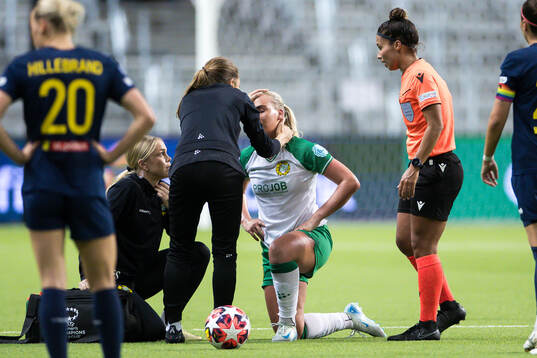 Cathinka Tandberg of Hammarby receives medical attention